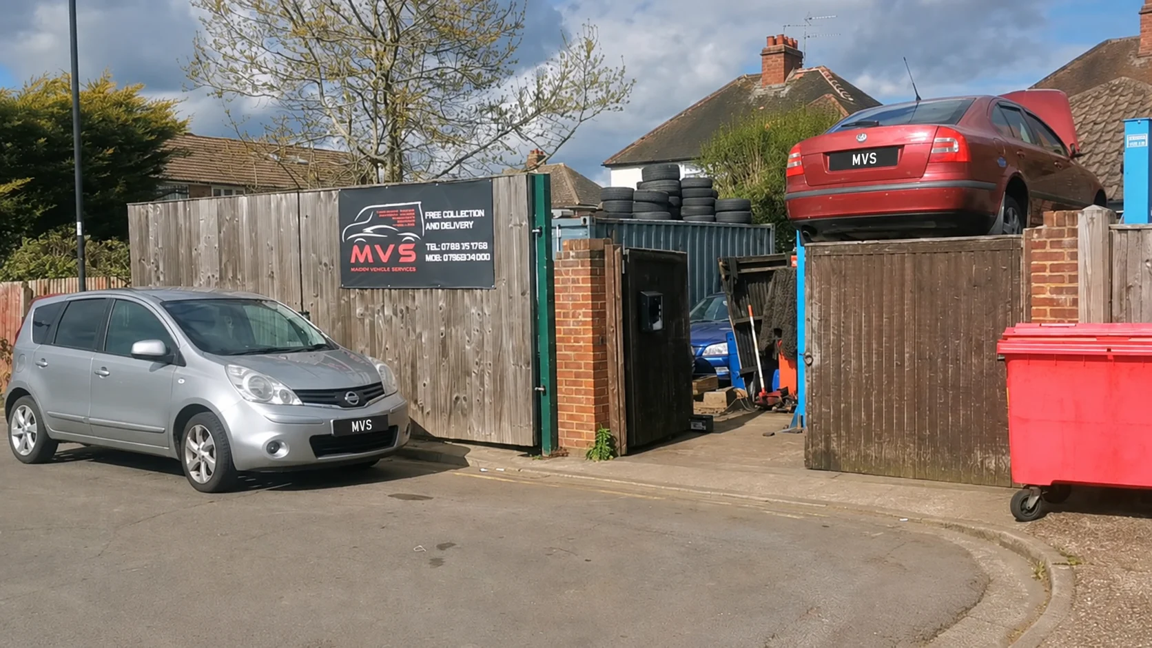 The real MVS sign, wooden gate and workshop entrance on Lorne Close