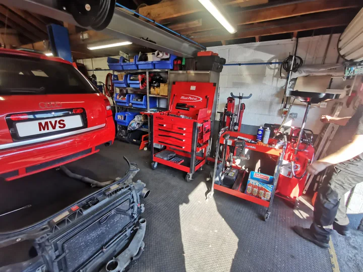 A car on the lift inside the MVS workshop